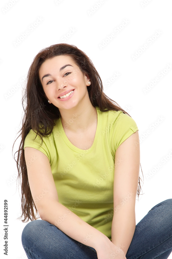 A pretty young woman sitting on the floor A pretty young woman sitting on the floor