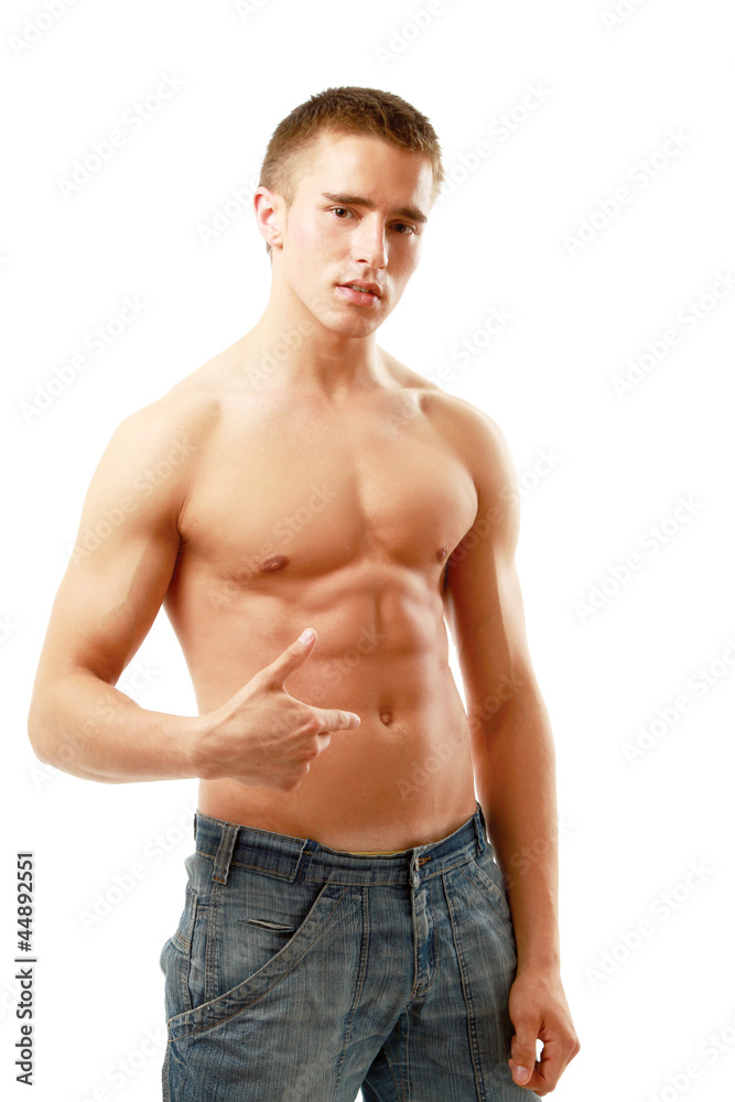 A muscular man showing his abs, isolated on white background