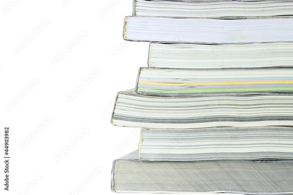 Stack of books on white background, partial view. Stack of books on white background, partial view.