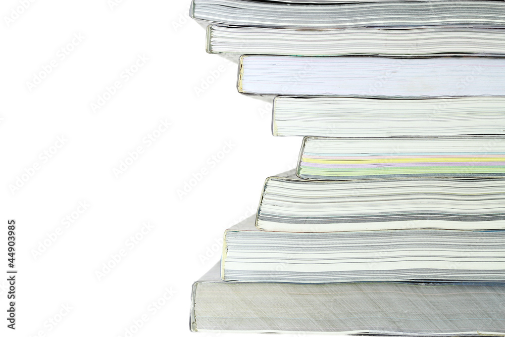 Stack of books on white background, partial view. Stack of books on white background, partial view.
