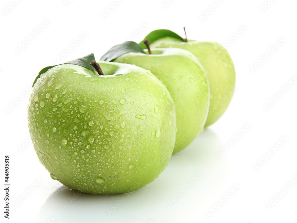 Ripe green apples with leaves isolated on white Ripe green apples with leaves isolated on white