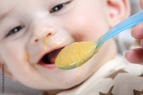 Baby boy eating vegetable mash