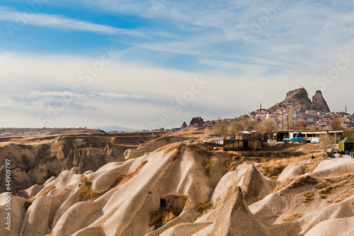 Canvas Print Ancient tuff stone caves and Uchisar castle in Goreme Cappadocia