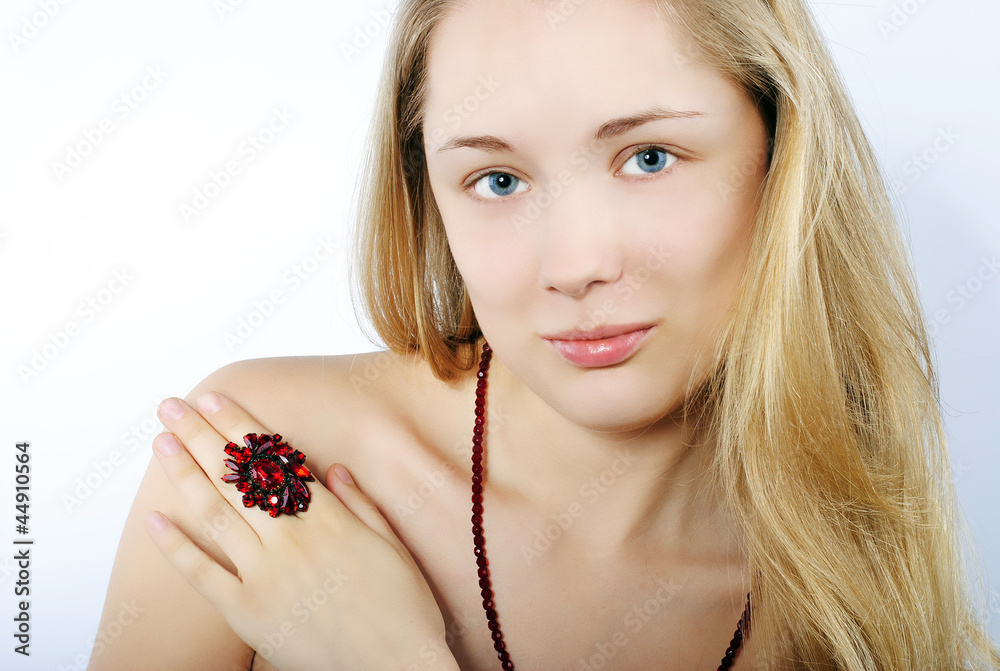 Portrait of the beautiful girl in costume jewellery