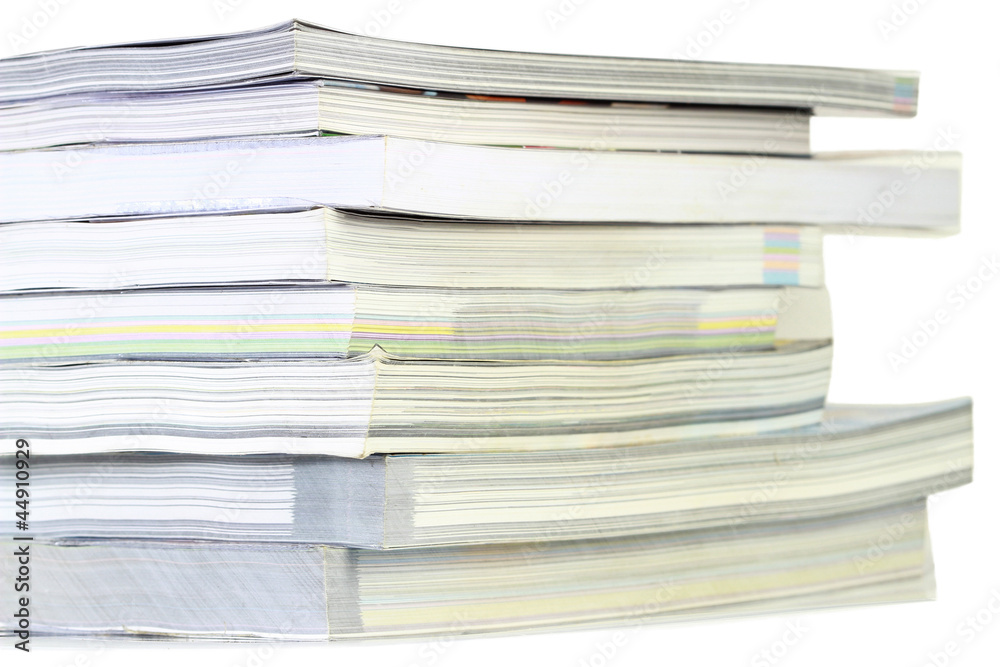 Stack of books on white background, partial view. Stack of books on white background, partial view.