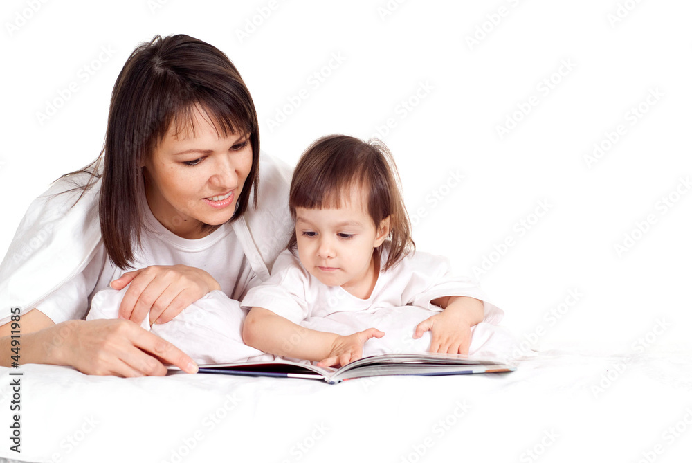 A beautiful good Caucasian mother with her daughter lying with a A beautiful good Caucasian mother with her daughter lying with a