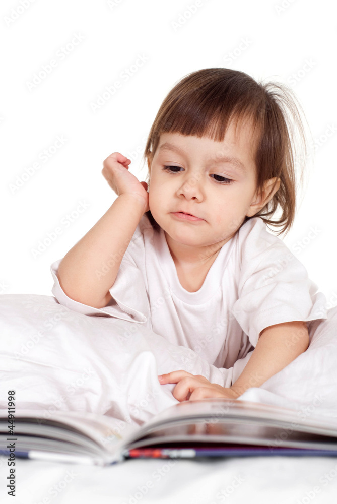 Pretty Caucasian young baby with a book Pretty Caucasian young baby with a book
