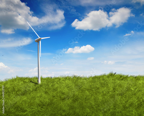 Turbine power generator on grass field under the blue sky
