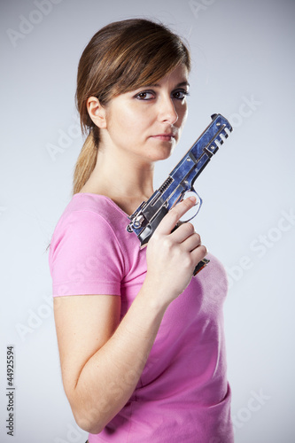 Woman aiming a handgun