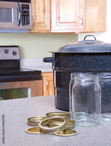 фотографія Canning jars and supplies in a kitchen