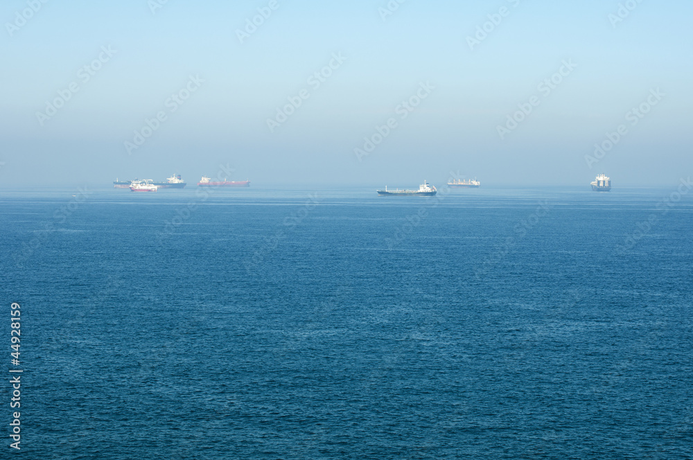 Cargo ships at sea.