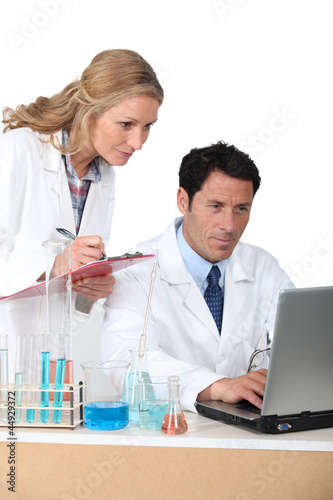 lab assistants on computer