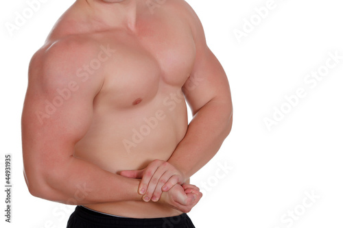 Young muscular man over white background