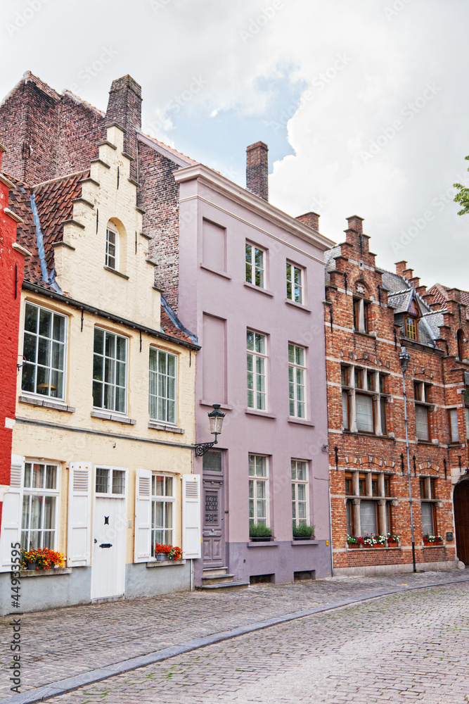 European small street with old brick houses. Bruges. Belgium.