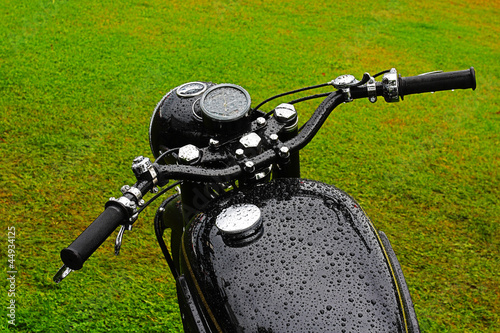 Black wet vintage motorbike