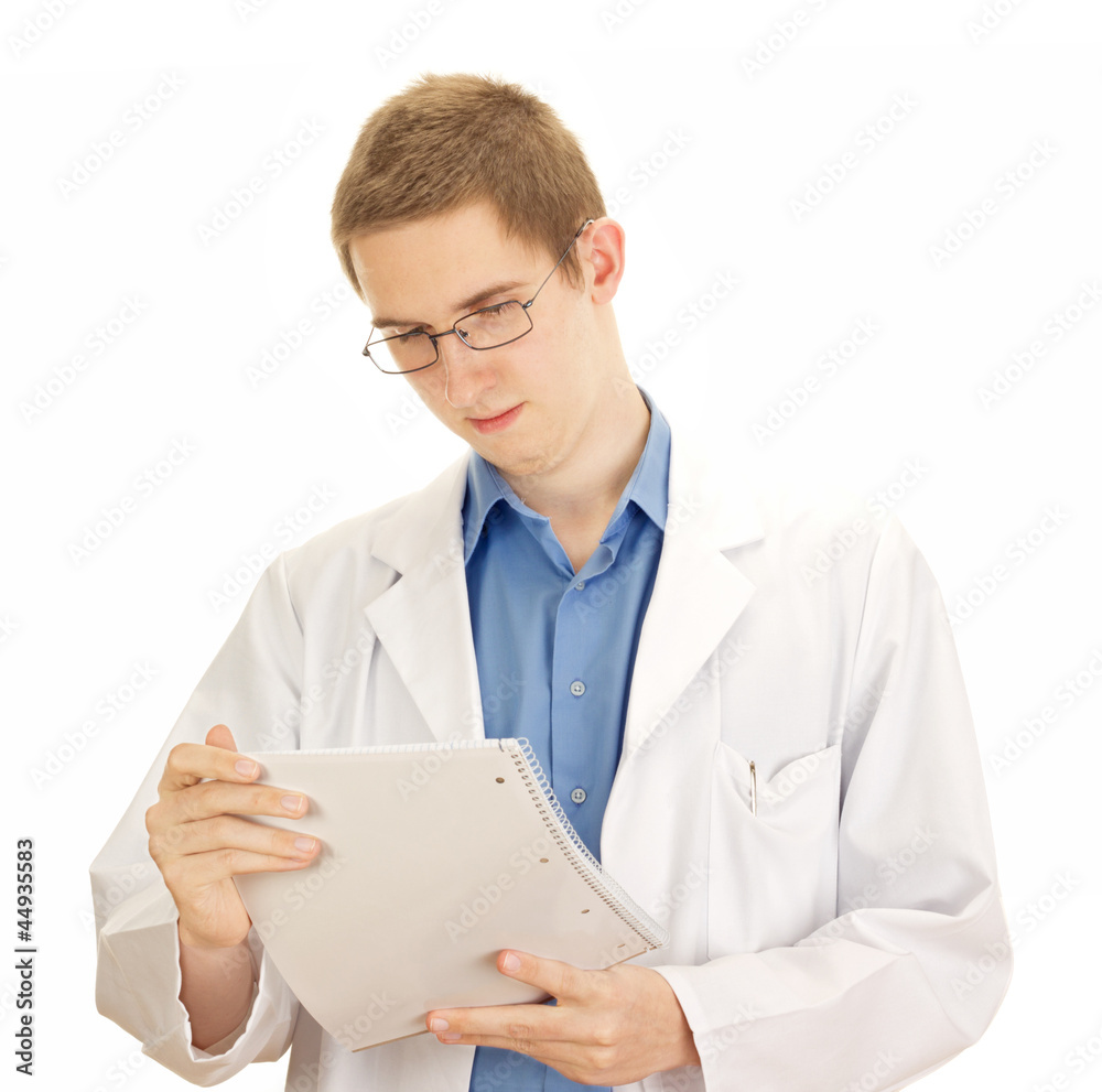 A young medical doctor with information about a patient A young medical doctor with information about a patient