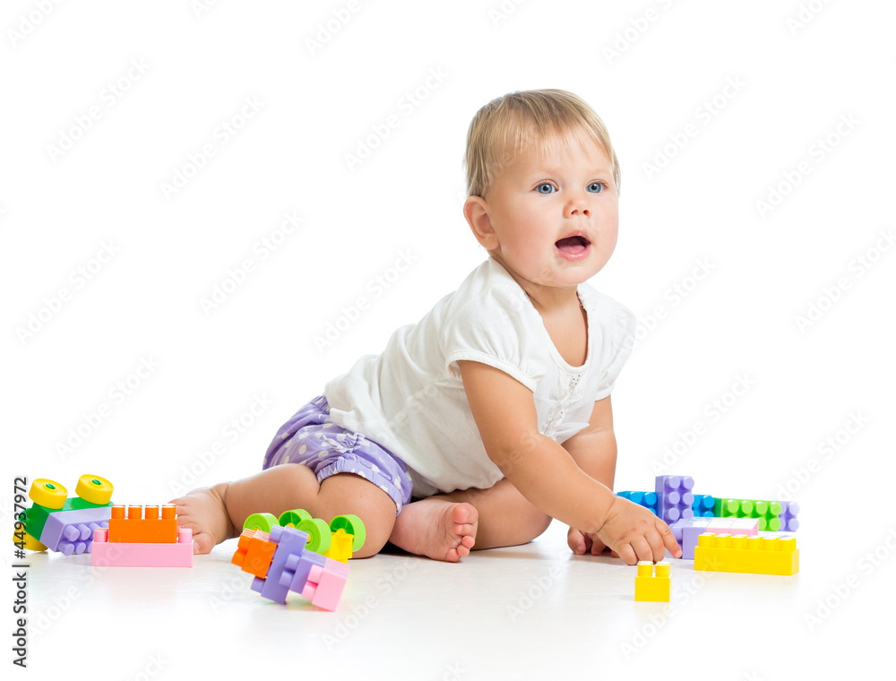little cheerful child with construction set over white backgroun little cheerful child with construction set over white backgroun