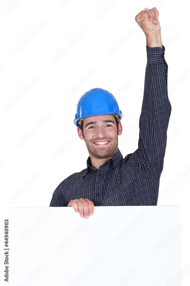 Happy laborer with fist up in the air Happy laborer with fist up in the air