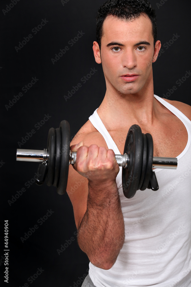 Man lifting dumbbell Man lifting dumbbell
