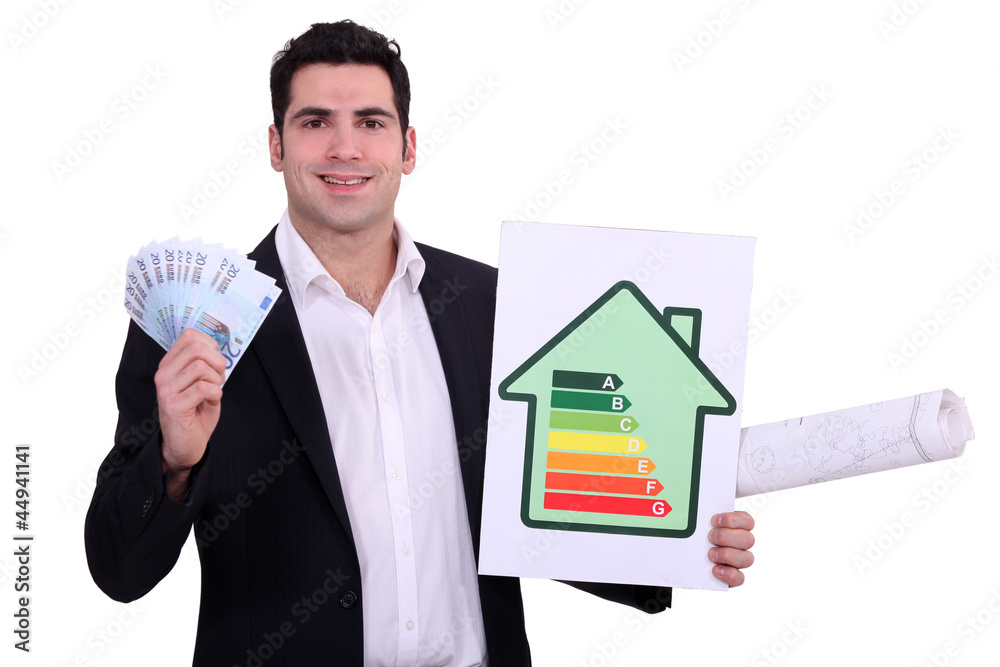 Man holding money and energy efficiency poster Man holding money and energy efficiency poster