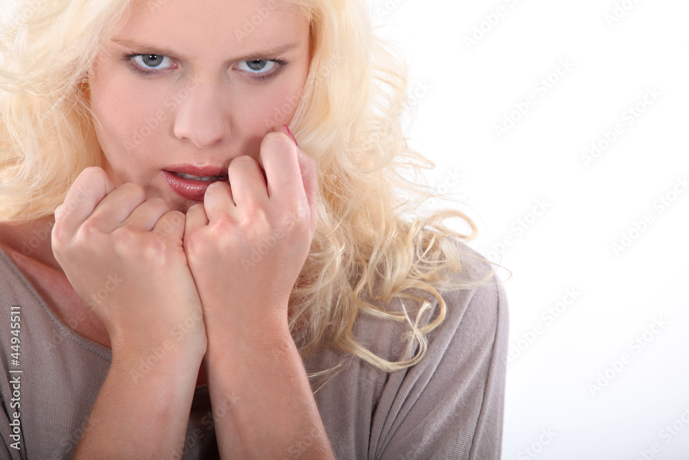 blond woman looking nervous blond woman looking nervous