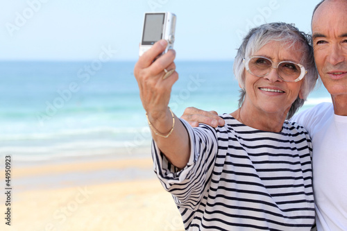 Senior couple taking a photo