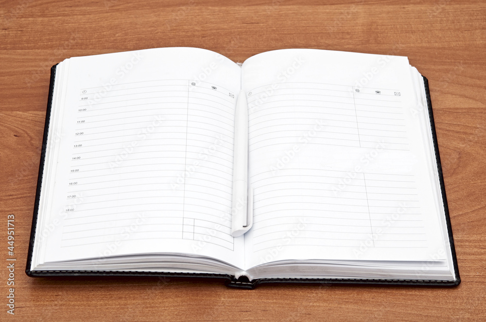 Open blank note book on wood Open blank note book on wood