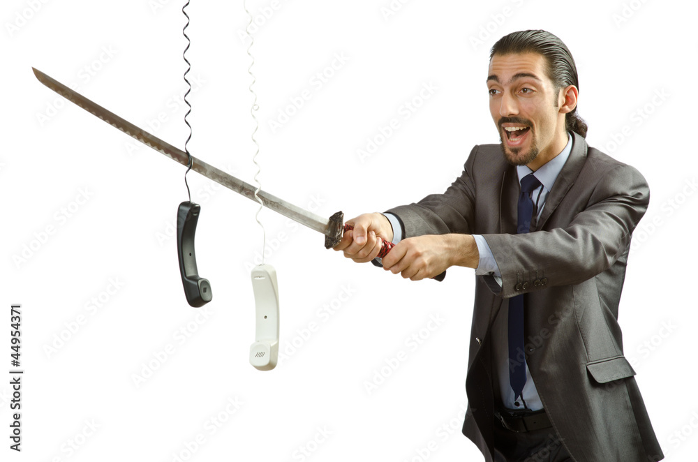 Angry businessman cutting the phone cable Angry businessman cutting the phone cable