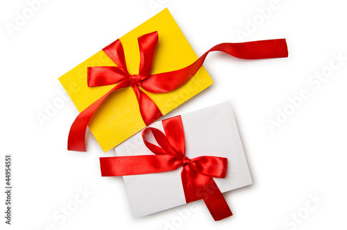 Envelope with colourful ribbon on white