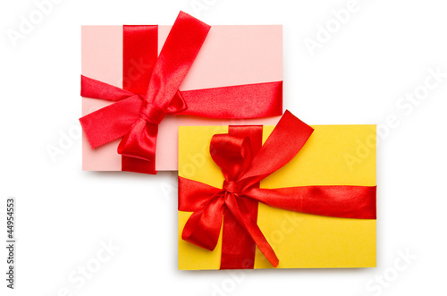 Envelope with colourful ribbon on white