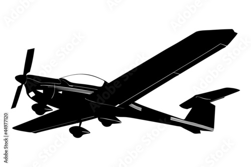 A silhouette of a small plane preparing to land