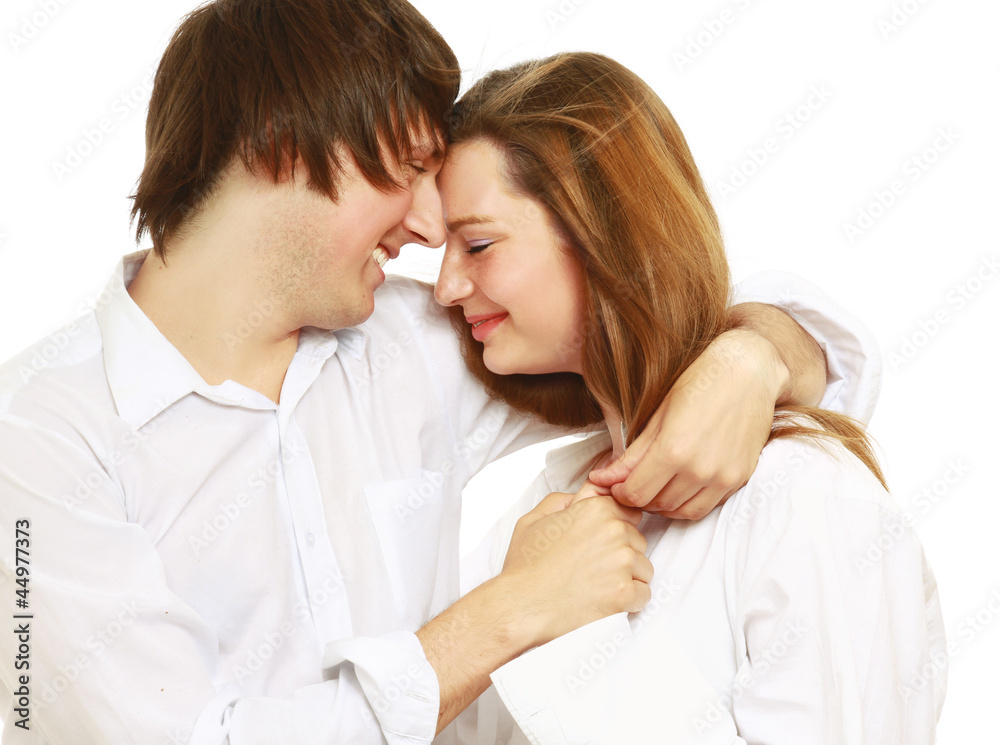 The man and the woman embrace. Isolated on the white background The man and the woman embrace. Isolated on the white background