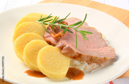 Pork with potato dumplings and white cabbage