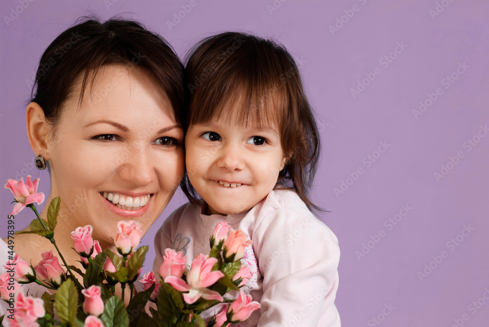 Caucasian female with a daughter and flowers Caucasian female with a daughter and flowers
