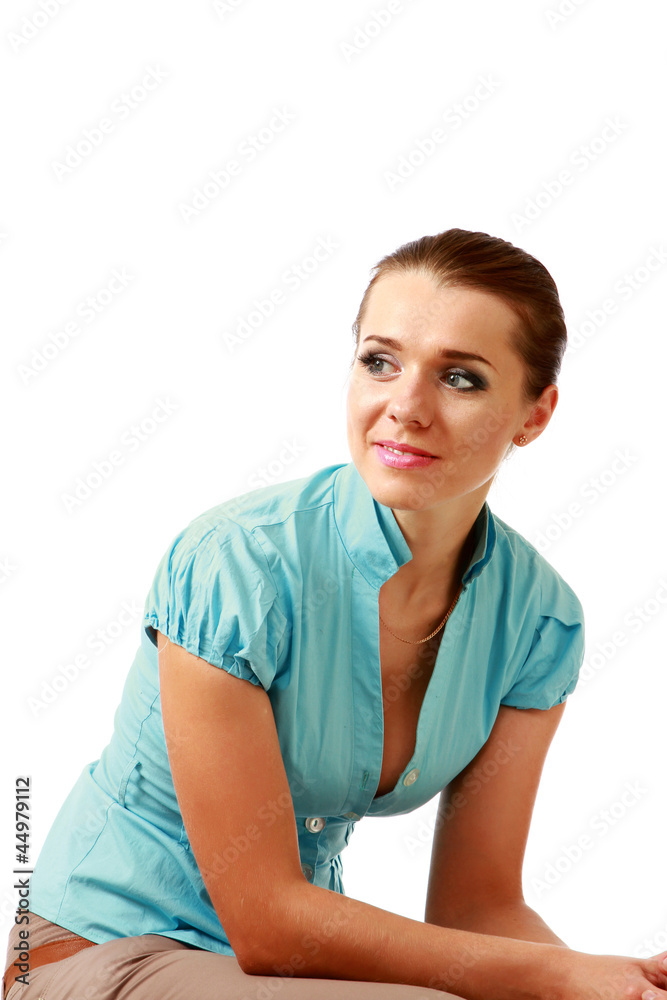 A young woman sitting, isolated on white A young woman sitting, isolated on white