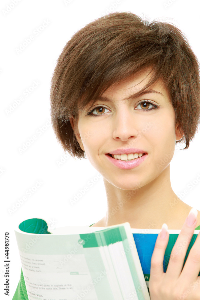 A young brunette woman (student) with books looking up A young brunette woman (student) with books looking up