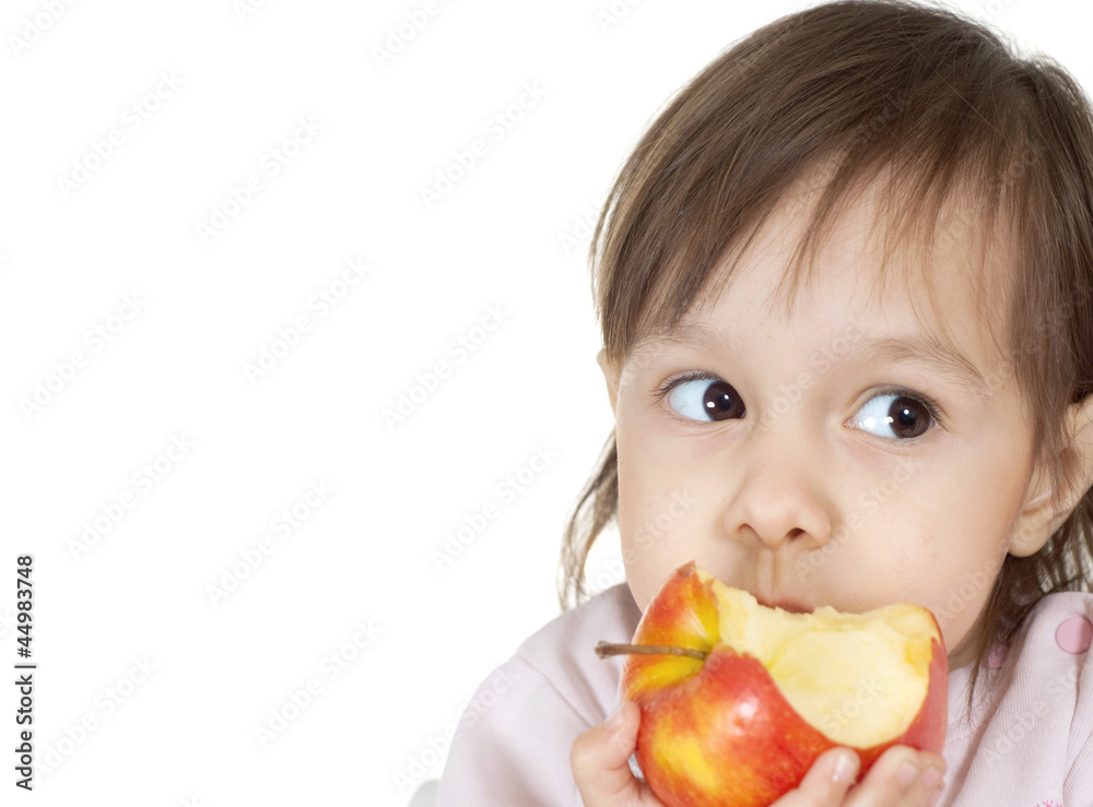 A beautiful Caucasian baby is eating an apple A beautiful Caucasian baby is eating an apple