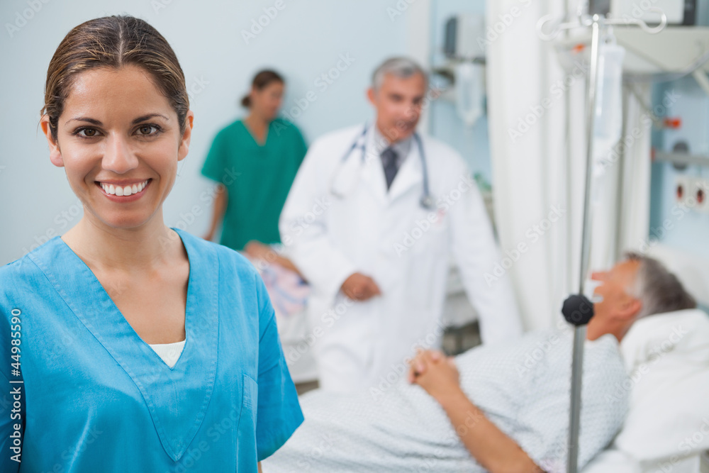 Happy nurse in hospital room Happy nurse in hospital room