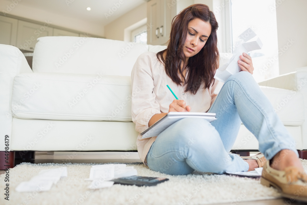 Young woman working out finances