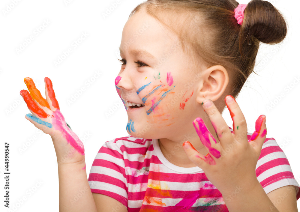 Obraz premium Portrait of a cute girl with painted hands