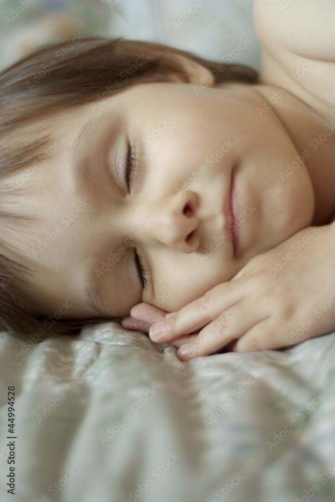 Pleasant little girl in bed