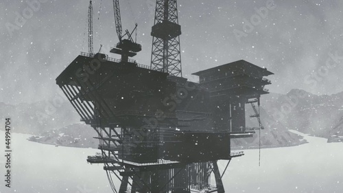 Oil rig platform standing in frozen sea photo