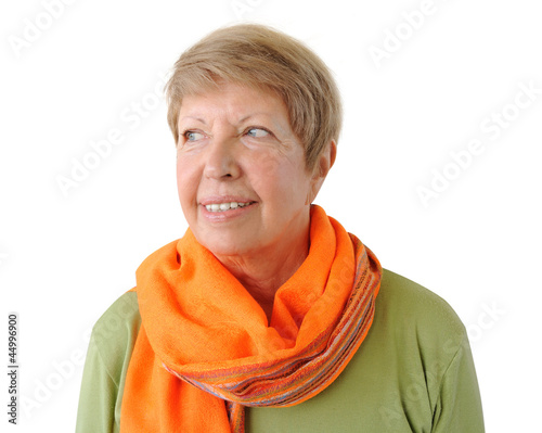 Fotografia, Obraz Portrait of elderly woman with orange cravat on the white backgr