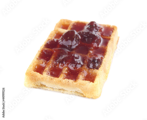 Tasty waffles with jam, isolated on white