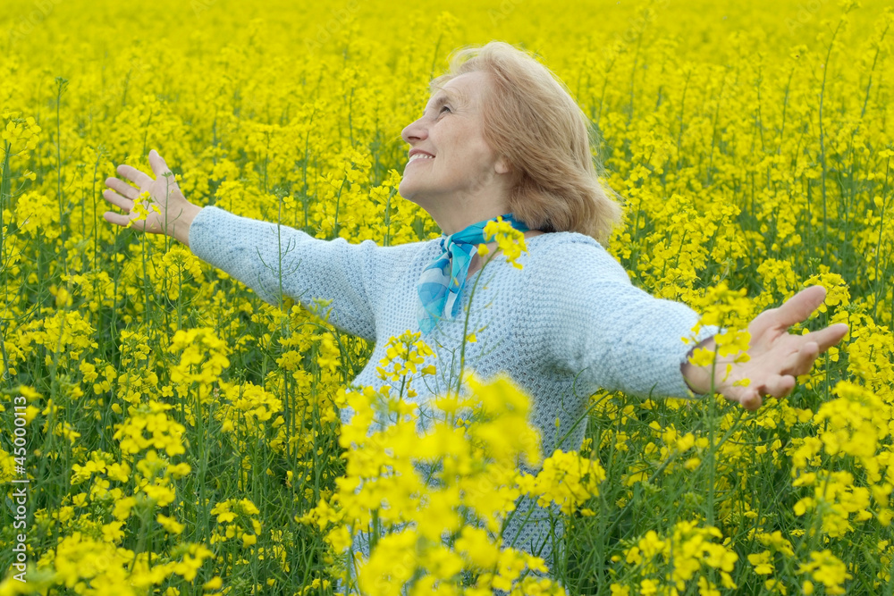 Lovely old woman is enjoying the air Lovely old woman is enjoying the air