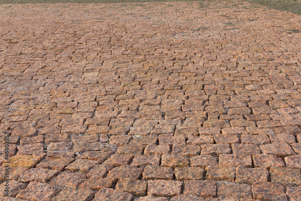 Granite brick road natural stone background close up Granite brick road natural stone background close up