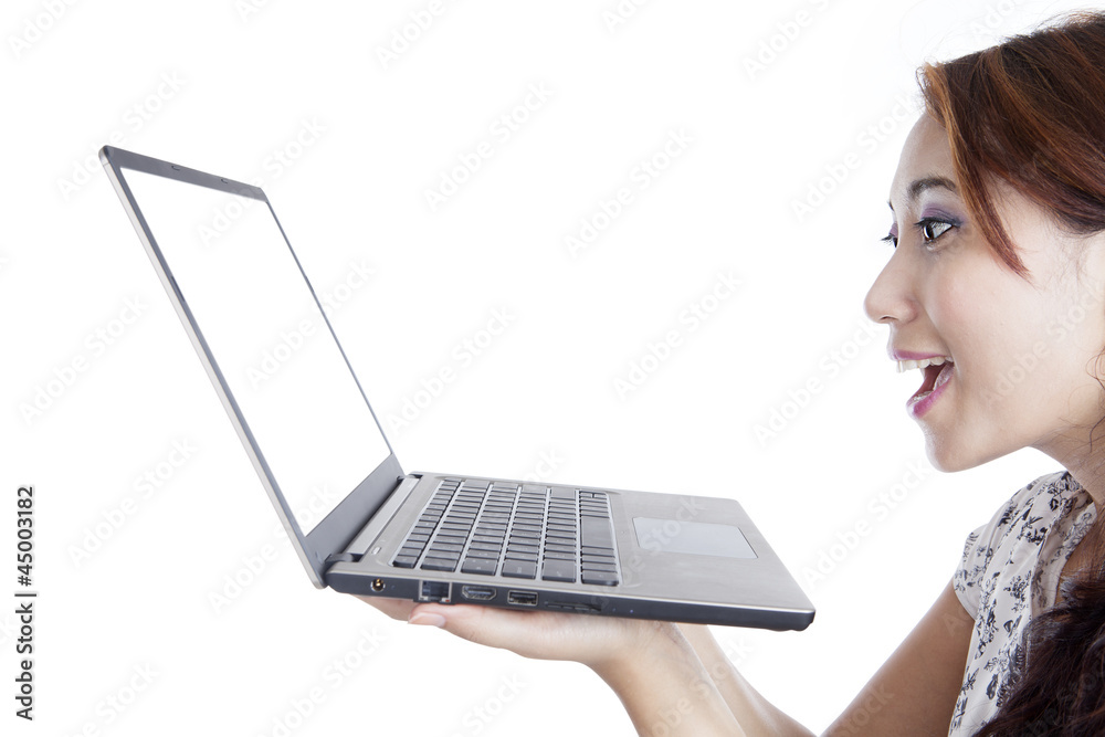 Amazed woman with laptop computer Amazed woman with laptop computer