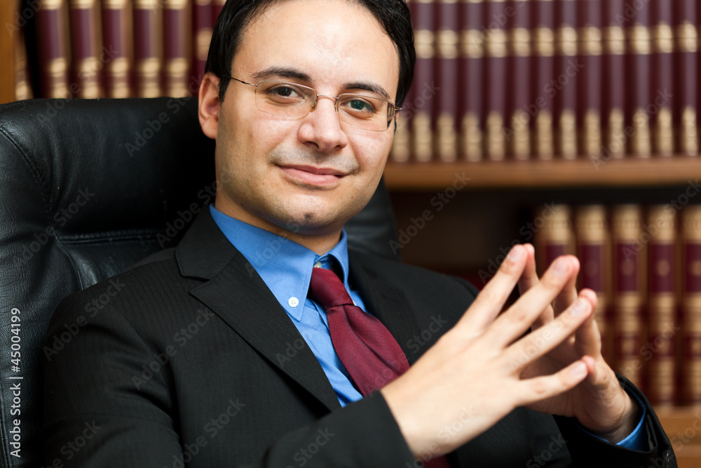 Fotografie Successful lawyer sitting in his studio