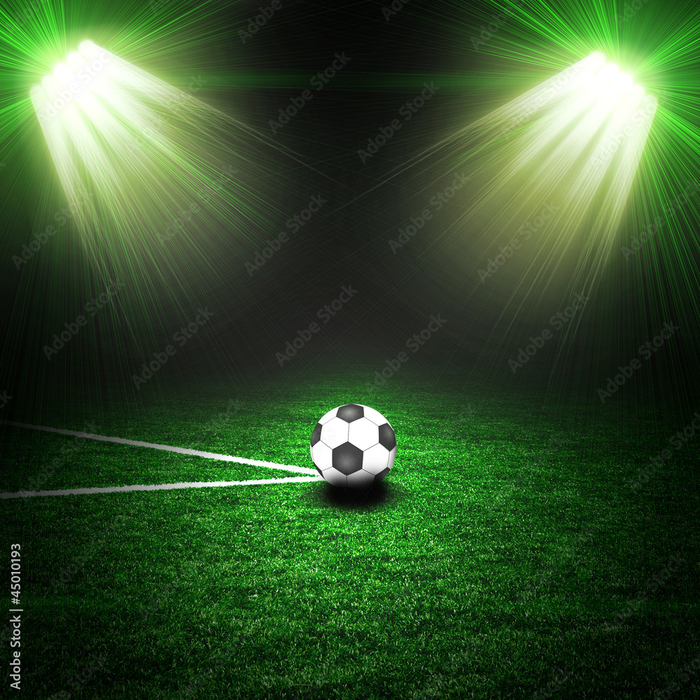 Fototapeta premium Soccer ball on the green field with lightnings