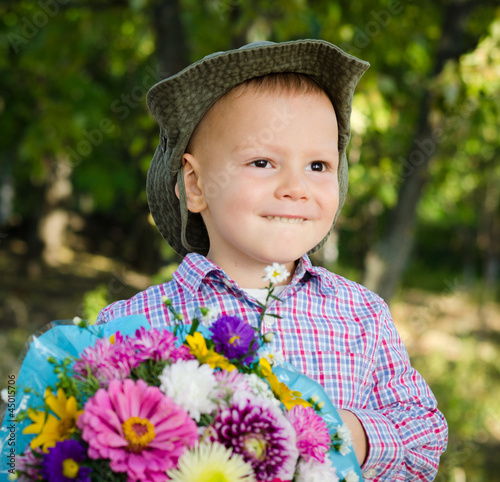 Little boy with flowers for his sweetheart